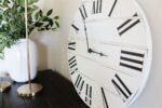 Simple White Lightly Distressed Large Wall Clock with Black Roman Numerals (in stock)